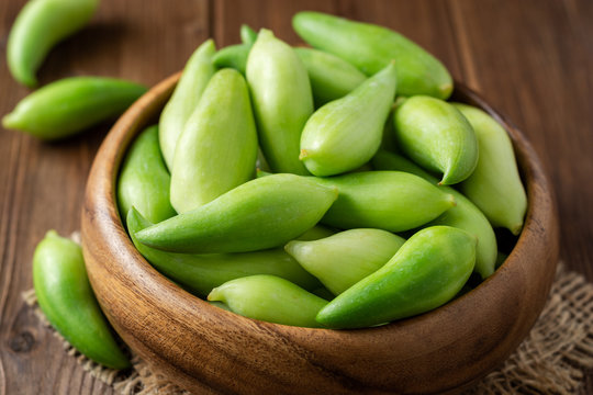 Cyclanthera pedata or kaywa or caigua or achuqcha - Latin American vegetable in bowl on wooden background. Selective focus.