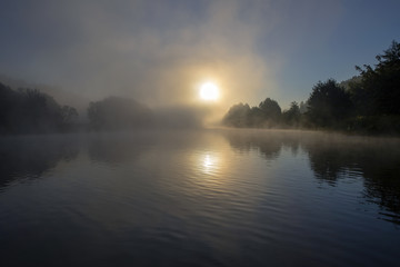 Fototapeta na wymiar Fog at dawn. Foggy morning. Thunder over the river.