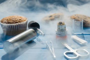 Still life with e-ciggarete and coffe on the wooden background