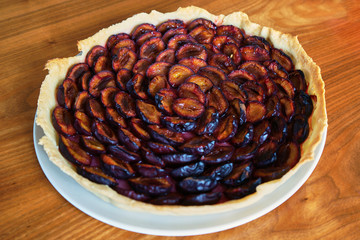 Plum Pie Right Out The Oven On A With Plate On A Wooden Table