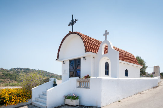 Traditional small whitewash Greek Orthodox Chapel.