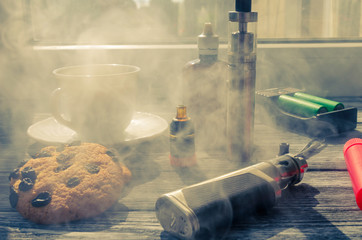 Still life with e-ciggarete and coffe on the wooden background