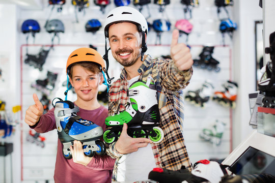 Father and son enjoying purchased roller-skates
