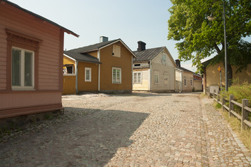 Fototapeta na wymiar Finland - Uusimaa - Porvoo - Abstract paved street with wooden houses in old northern town