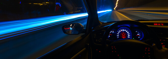 Movement of the car at night at a speed view from the interior, Brilliant road with lights with a...