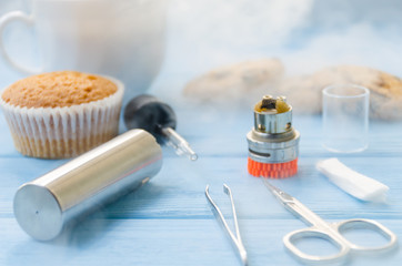 Still life with e-ciggarete and coffe on the wooden background