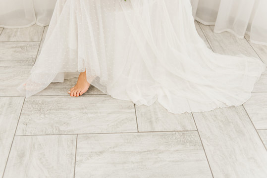 barefoot bride in long wedding dress