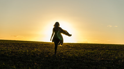 Girl Walking Into The Sunset