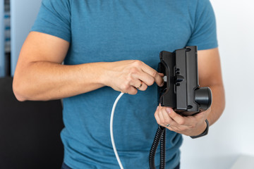 Specialist connects the phone to the network, VoIP Telephony, modern technology