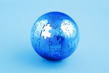 Globe made out of puzzle pieces - global business/global