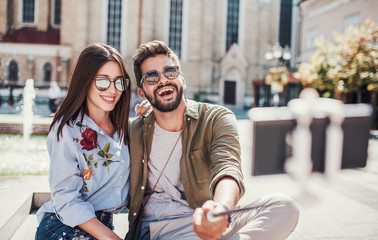 Happy couple making a selfie with mobile phone. Dating, love, relationships, lifestyle concept