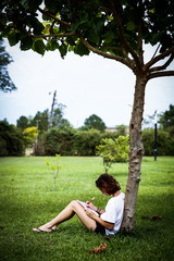 Reading under tree