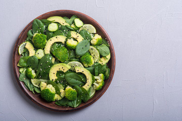 Green baby spinach salad with avocado