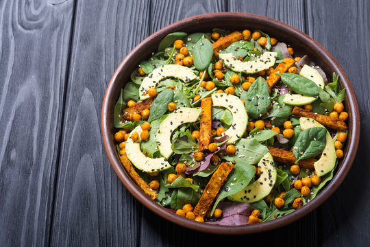 Baby spinach salad with sweet potato , chickpeas and avocado