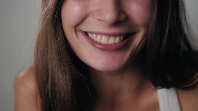 Woman smiling with perfect smile and white teeth laughing smile