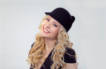 happy woman in funny hat, looking at camera, smiling