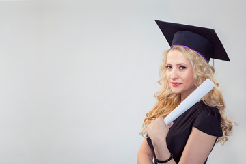  smiling graduate young woman holding her diploma