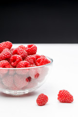 Photo of raspberries in transparent cup