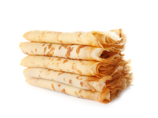 Stack of tasty thin folded pancakes on white background