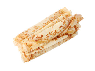 Tasty thin pancake rolls on white background, top view