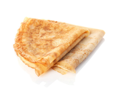 Tasty thin folded pancakes on white background