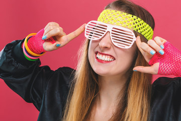 Woman in 1980's fashion theme on a pink background