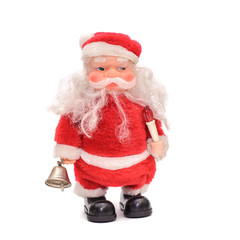 A toy Santa in a red suit on white background
