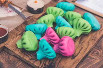 Colorful And Bright Meat Dumplings On Wooden Serving Board With Sauces Like Ketchup And Sour Cream. Traditional Asian Cuisine. Concept Of Beautiful, Appetizing And Healthy Food.