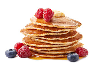 Stack of pancakes with maple syrup and fresh berries on white © robertsre