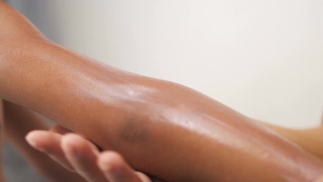 Mother apply medical cream for her daughter, skin allergy concept.