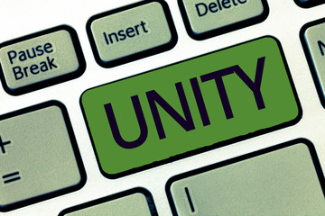 Handwriting text writing Unity. Concept meaning state of being united or joined as whole becoming one person.