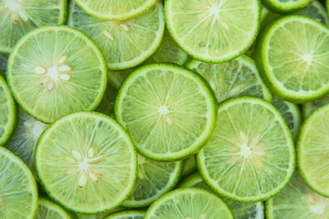 Fototapeta na wymiar Citrus fruit of lime slices background
