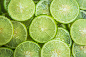 Citrus fruit of lime slices background