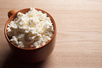 Cottage cheese wooden table. Rustic food