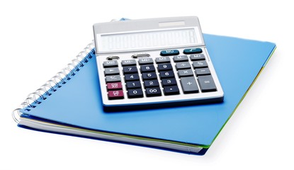 Calculator on top of a notebook