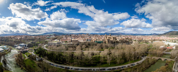 Aerial panorama view of fortified medieval Pamplona in Spain with dramatic cloudy blue sky