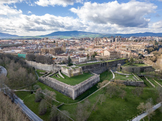 Aerial panorama view of fortified medieval Pamplona in Spain with dramatic cloudy blue sky