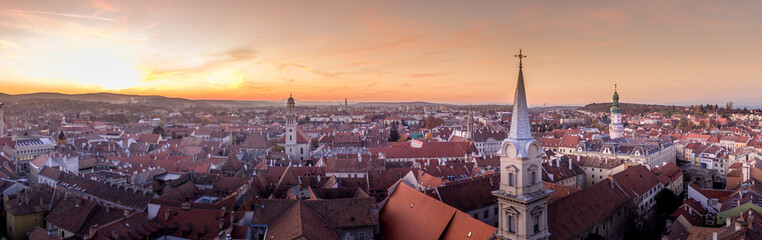 Aerial sunset view of medieval Sopron with church and red roof houses