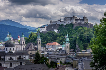 Panoramic view of Salzburg with castle, cathedrl and dramatic sky 