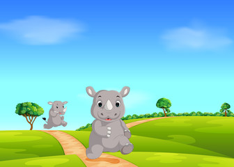 Fototapeta premium the natural forest with the big rhino walking on the ground street 