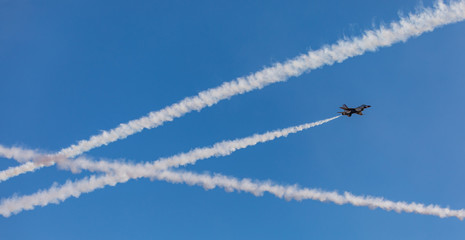 Crisscrossing smoke trails of the jets