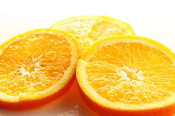 Orange Slice on white background / Orange is a citrus fruit that is quite delicious, juicy with high content Vitamin C. 