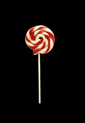 Colourful lollipop isolated on the black background.