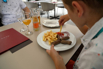 Cevapcici or cevapi, boy lunch or dinner at the restaurant