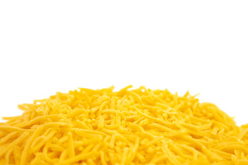 Pile of Grated Cheddar Cheese on a White Background
