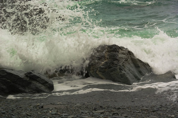 The sea foam, a splash of the wave crashed into the stone.