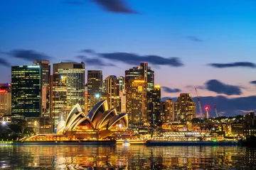 Foto op Plexiglas Australië Sydney Opera House in Sydney, Australië. Het Sydney Opera House organiseert elk jaar meer dan 1.500 uitvoeringen die worden bijgewoond door ongeveer 1,2 miljoen mensen.
