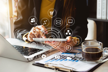 Digital marketing media in virtual screen.businesswoman hand working with mobile phone and modern...