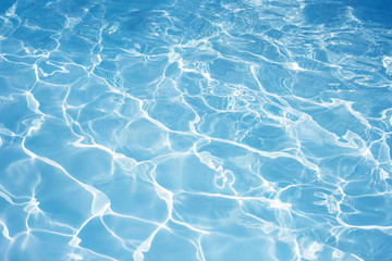 Texture of water in swimming pool for background