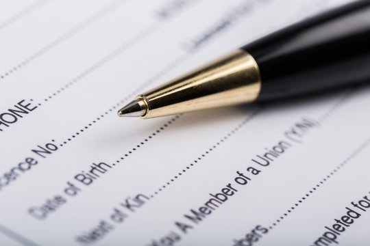 questionnaire form with a pen